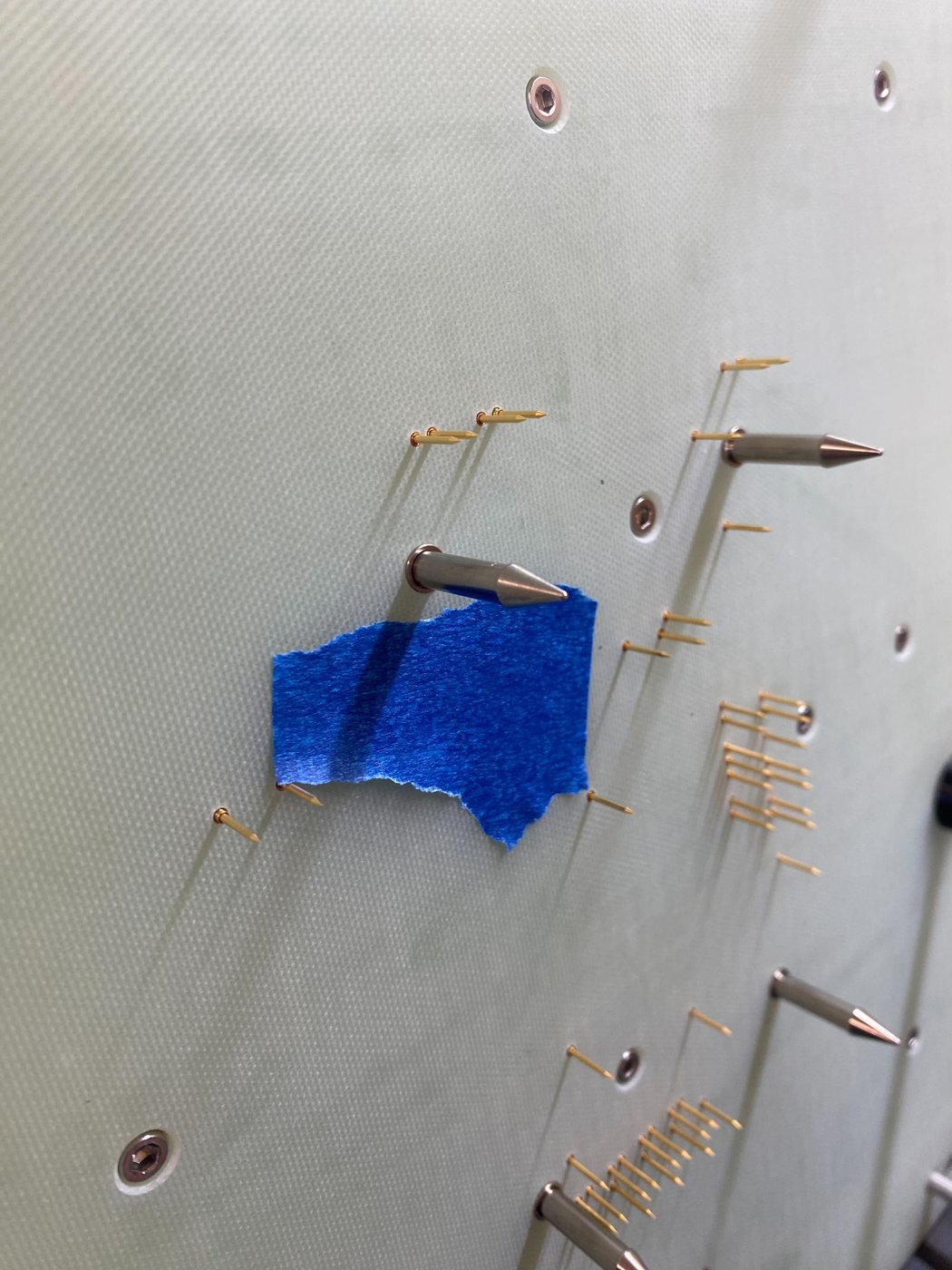 Masking tape holding the receptacle flush