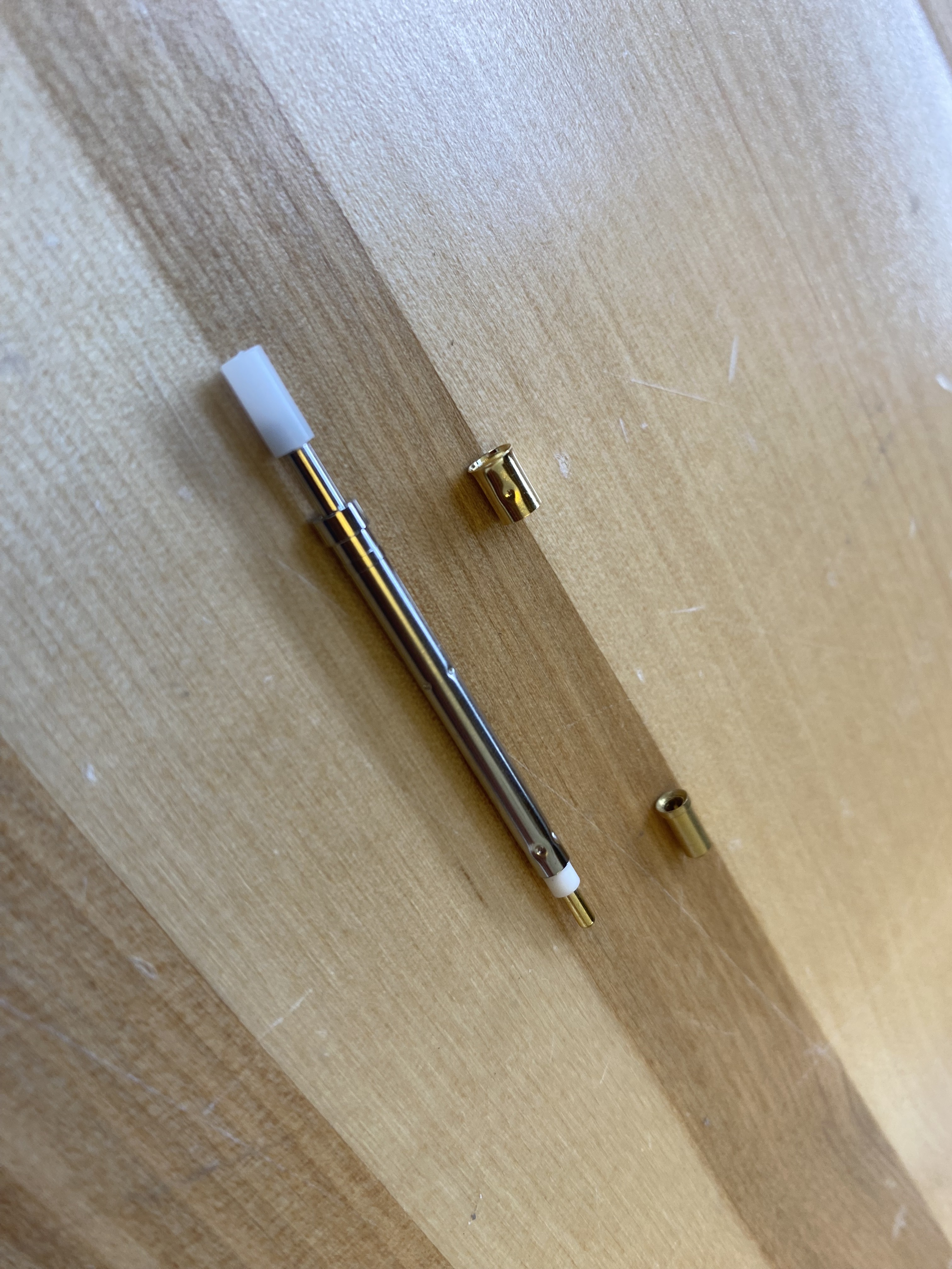 KG-300K: Switching probe (left), receptacle (top right), solder tab (bottom right)